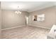 Spacious living area showing wood floors and natural lighting at 13835 Se 85Th Cir, Summerfield, FL 34491