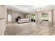 Bright living room showcasing sliding glass doors and neutral decor at 13835 Se 85Th Cir, Summerfield, FL 34491