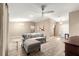 Bright and open living space featuring modern hardwood flooring, a comfortable sectional sofa, and contemporary decor at 13835 Se 85Th Cir, Summerfield, FL 34491