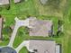 Aerial perspective highlights the home's landscaped backyard, screened pool, and expansive patterned driveway at 1443 Sw 161St St, Ocala, FL 34473