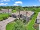 Expansive aerial view of property with lush landscaping, a well-manicured lawn, and a paved driveway at 1443 Sw 161St St, Ocala, FL 34473