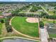 Aerial view of a pristine community baseball field with lush green grass, a well-maintained diamond, and an open sky at 1443 Sw 161St St, Ocala, FL 34473