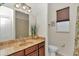 Bathroom with a vanity, mirror, and enclosed shower, plus a convenient window at 1443 Sw 161St St, Ocala, FL 34473
