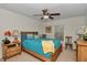 Inviting bedroom with a comfortable bed, ceiling fan, and bedside tables at 1443 Sw 161St St, Ocala, FL 34473