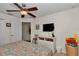 Bright bedroom with a ceiling fan, closet and wall-mounted TV at 1443 Sw 161St St, Ocala, FL 34473