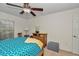 Bright bedroom featuring a ceiling fan, carpet, window, and neutral walls at 1443 Sw 161St St, Ocala, FL 34473