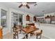 Open dining area with a wooden table and chairs, seamlessly connected to the kitchen at 1443 Sw 161St St, Ocala, FL 34473