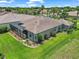 A beautiful home featuring manicured landscaping and a screened-in lanai, perfect for outdoor living and entertaining at 1443 Sw 161St St, Ocala, FL 34473