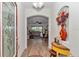 Bright foyer with a decorative front door, wooden floors, and a view into the living area at 1443 Sw 161St St, Ocala, FL 34473