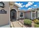 Inviting front entrance with decorative details, seating, and beautiful plants, adding curb appeal at 1443 Sw 161St St, Ocala, FL 34473