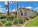 Stunning shot of landscaping, mature palm trees, and lush lawn, providing incredible curb appeal at 1443 Sw 161St St, Ocala, FL 34473