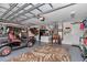 Spacious garage with a golf cart, rug, and storage at 1443 Sw 161St St, Ocala, FL 34473