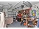 Functional garage interior with tools, workbench, and ample storage space at 1443 Sw 161St St, Ocala, FL 34473