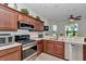 Well-equipped kitchen featuring stainless steel appliances and ample wood cabinetry at 1443 Sw 161St St, Ocala, FL 34473
