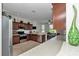 Open-concept kitchen with stainless steel appliances, ample cabinet space, and a seamless connection to dining area at 1443 Sw 161St St, Ocala, FL 34473