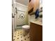 Traditional bathroom featuring a shower, toilet, vanity, and medicine cabinet with a tiled backsplash and patterned floors at 1523 Se 80Th St, Ocala, FL 34480