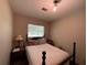 Bedroom featuring a bed and end table with a lamp at 1523 Se 80Th St, Ocala, FL 34480