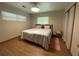 Cozy bedroom with wood floors, natural light, and neutral wall color at 1523 Se 80Th St, Ocala, FL 34480