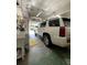 Spacious garage featuring a washing machine and a car parked near the open garage door at 1523 Se 80Th St, Ocala, FL 34480