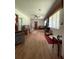 Comfortable living room featuring wood-look floors, neutral paint, and a ceiling fan at 1523 Se 80Th St, Ocala, FL 34480