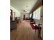 Comfortable living room featuring wood-look floors, neutral paint, and a ceiling fan at 1523 Se 80Th St, Ocala, FL 34480