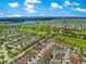 Expansive aerial showing the community with golf courses and ponds, highlighting location and natural beauty at 1751 Brandenburg Ct, The Villages, FL 32163