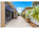 Exterior shot of home showing outdoor living space and manicured landscaping, highlighting its appeal at 1751 Brandenburg Ct, The Villages, FL 32163