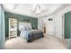 Comfortable bedroom with tray ceiling, tranquil decor, and a soothing ambiance at 1751 Brandenburg Ct, The Villages, FL 32163