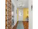Inviting foyer with hardwood floors, a decorative chandelier, and views into the dining and living areas at 1751 Brandenburg Ct, The Villages, FL 32163
