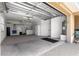 Spacious three car garage featuring epoxy floors, lots of storage and a laundry area at 1751 Brandenburg Ct, The Villages, FL 32163