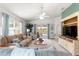 Bright living room with lots of natural light, access to patio, and nice decor at 1751 Brandenburg Ct, The Villages, FL 32163
