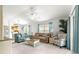 Cozy living room with neutral-colored walls, slider to the patio, and ample seating at 1751 Brandenburg Ct, The Villages, FL 32163
