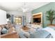 Comfortable living room features access to patio and stylish built-in entertainment center at 1751 Brandenburg Ct, The Villages, FL 32163