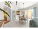 Open concept living and dining areas with sliding glass doors to outdoor living at 1751 Brandenburg Ct, The Villages, FL 32163