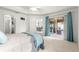 Main bedroom features tray ceilings, and slider to the porch at 1751 Brandenburg Ct, The Villages, FL 32163