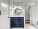 Charming bathroom with stylish vanity, round mirror, and tiled floors at 1922 Se 13Th St, Ocala, FL 34471