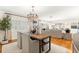 Dining room with hardwood floors, a chandelier, and an open layout to the living area at 1922 Se 13Th St, Ocala, FL 34471