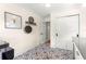Hallway with stylish tile flooring, coat rack, and access to other rooms at 1922 Se 13Th St, Ocala, FL 34471