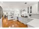 Bright and modern kitchen featuring white cabinets, stainless steel appliances, and hardwood floors at 1922 Se 13Th St, Ocala, FL 34471