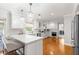 Bright kitchen with hardwood floors, large pendant lights, and a breakfast bar with seating at 1922 Se 13Th St, Ocala, FL 34471