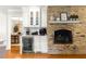 Living area with a beverage bar next to a fireplace and wood floors at 1922 Se 13Th St, Ocala, FL 34471