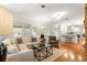 Open-concept living room with hardwood floors and a view into the updated kitchen at 1922 Se 13Th St, Ocala, FL 34471