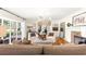 Living room featuring hardwood floors, brick fireplace, and lots of windows at 1922 Se 13Th St, Ocala, FL 34471