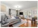 A well-lit main bedroom featuring hardwood floors, a chandelier, and french doors at 1922 Se 13Th St, Ocala, FL 34471