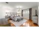 Main bedroom with hardwood floors, neutral colors, and plenty of natural light at 1922 Se 13Th St, Ocala, FL 34471