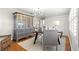 Office with custom gray built-in cabinet and desk, complemented by a modern chandelier at 1922 Se 13Th St, Ocala, FL 34471
