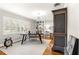 Bright office with a modern chandelier, white plantation shutters, and built-in shelves at 1922 Se 13Th St, Ocala, FL 34471