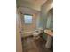 Bathroom featuring a toilet, tub, and sink at 20045 Sw 88Th Place Rd, Dunnellon, FL 34431