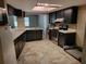 Kitchen boasting stainless steel appliances, ample countertop space, and natural light from a skylight at 20045 Sw 88Th Place Rd, Dunnellon, FL 34431