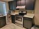 Kitchen with stainless steel appliances and white countertops at 20045 Sw 88Th Place Rd, Dunnellon, FL 34431